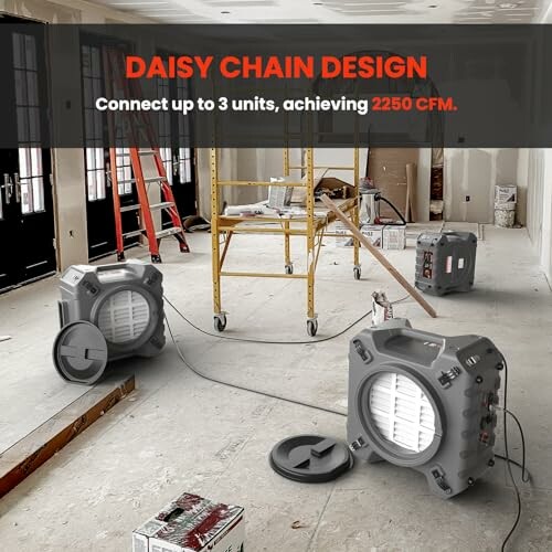 Two industrial air movers on a construction site with daisy chain design.